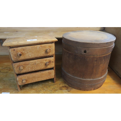 83 - A 20th century pine diminutive three drawer chest and a lidded pine bucket (2)