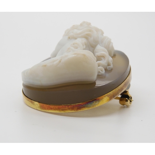 755 - A CRAFTSMAN CARVED AGATE CAMEO OF A MAIDEN mounted as a pendant brooch in yellow metal, dimensions 4... 