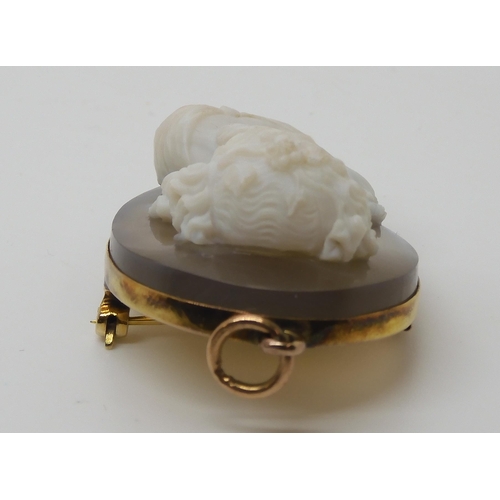 755 - A CRAFTSMAN CARVED AGATE CAMEO OF A MAIDEN mounted as a pendant brooch in yellow metal, dimensions 4... 