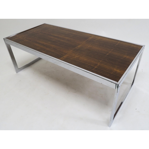 111 - A MID 20TH CENTURY ROSEWOOD AND CHROME HOWARD MILLER FOR MDA COFFEE TABLE 42cm high x 115cm long x 5... 