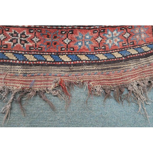 131 - A BLACK GROUND CAUCASIAN RUGwith four medallions and multicoloured borders, 246cm long x 137cm wide... 