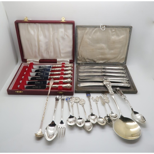 355 - A collection of silver including silver and enamel city souvenir spoons, some stamped sterling, a ca... 