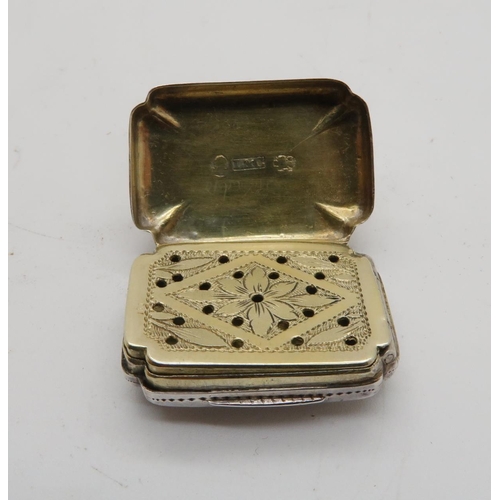 359 - A George III silver vinaigrette, of shaped rectangular form, with engraved floral decoration surroun... 