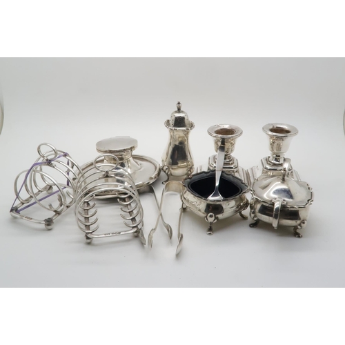 370 - A collection of silver including a pair of four division silver toast racks, by Atkins Brothers, She... 