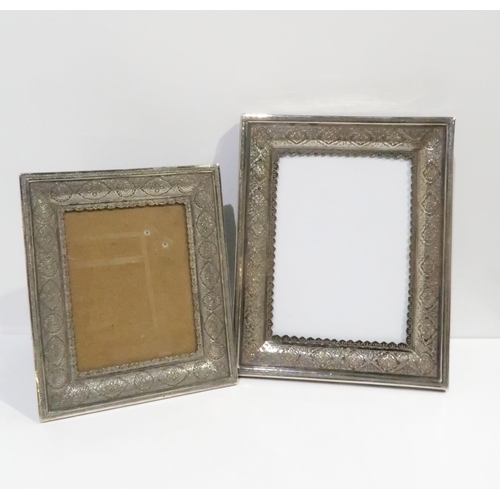 383 - Two Iranian silver photo frames, decorated with arabic lozenge and medallion motifs, both hallmarked... 