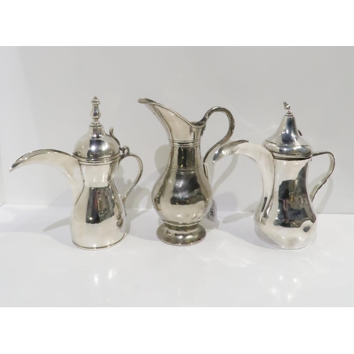 387 - A Persian white metal Dallah coffee pot, with shell thumbpiece, and another, and a white metal pitch... 