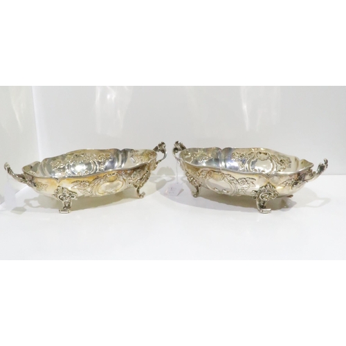 388 - Two Danish silver twin handled fruit baskets, both of lobed form, with repousse scrolling foliate de... 