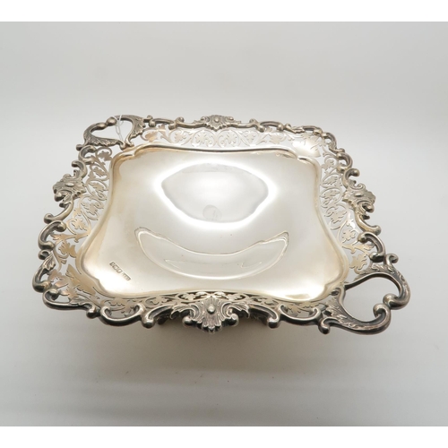 392 - An Edwardian silver tazza, of rectangular form with pierced scrolling fretwork, on a lobed base upon... 