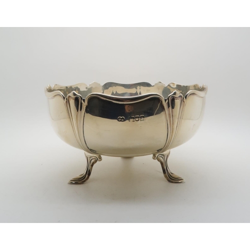 393 - An Art Nouveau rose bowl, of lobed stylised form, upon three leaf motif feet, by James Aitchison, Lo... 