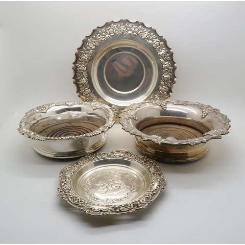 394 - An Elizabeth II silver wine coaster, with shellwork rim and turned wooden base, by Mappin & Webb... 