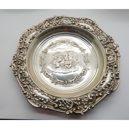 394 - An Elizabeth II silver wine coaster, with shellwork rim and turned wooden base, by Mappin & Webb... 