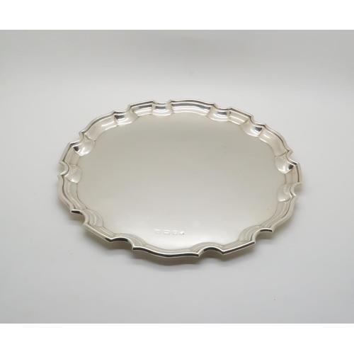 395 - A George VI silver serving tray, with piecrust rim, by Charles Green & Sons, Birmingham 1936, 42... 