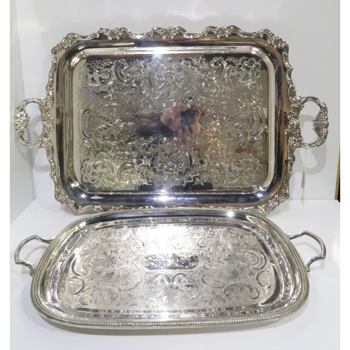 413 - A lot comprising two silver plated decorative serving trays