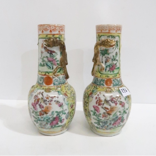 296 - A pair of Canton yellow ground vases with applied dragon detail, 20cm high, a saucer painted with fi... 