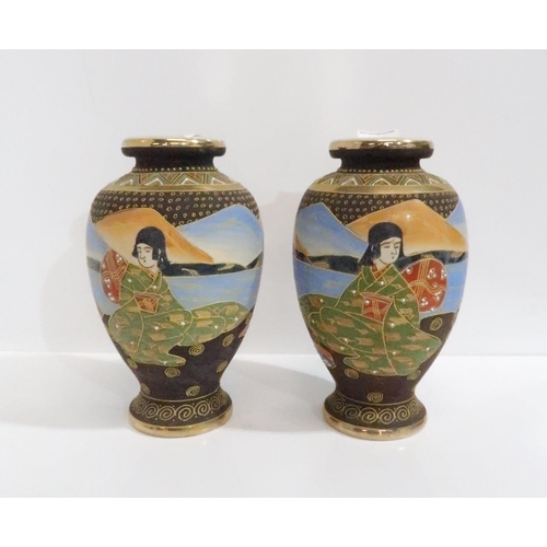 298 - A pair of Satsuma vases decorated with Geishas