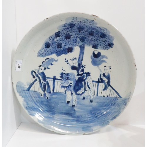 300 - A blue and white charger decorated with a figure on the back of a Kylin, 40cm diameter and a lacquer... 