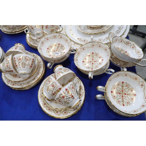 309 - A Tuscan Richelieu pattern dinner service comprising plates, bowls, coffee pot, platters, soup coupe... 