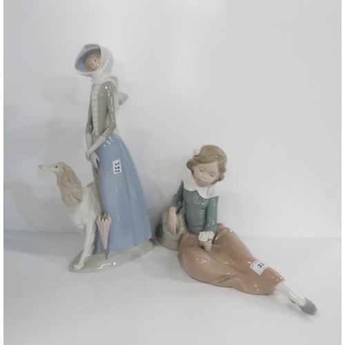 333 - A large Lladro figure of a woman and Borsoi dog, together with a Nao figure of a girl holding a posy... 