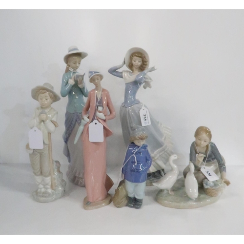 334 - A collection of Lladro and Nao figures of ladies and children