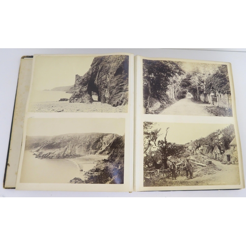 435 - a photographic and country house scrap album comprising; 1890s photographs of Sark, Skye, Aviemore, ... 