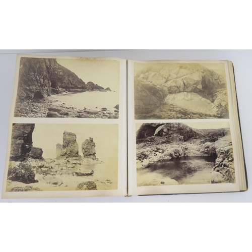 435 - a photographic and country house scrap album comprising; 1890s photographs of Sark, Skye, Aviemore, ... 