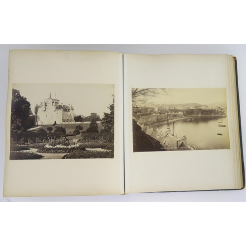 435 - a photographic and country house scrap album comprising; 1890s photographs of Sark, Skye, Aviemore, ... 