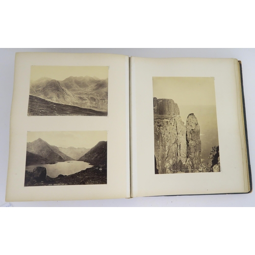 435 - a photographic and country house scrap album comprising; 1890s photographs of Sark, Skye, Aviemore, ... 