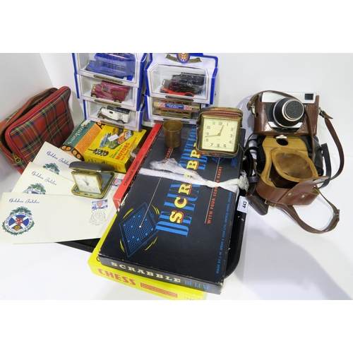 443 - A tray lot comprising vintage board games, cameras, toy cars, travel clocks, coins, etc