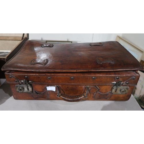 463 - A Chinese leather suitcase, and two WWI brass trench art shells engraved with France and Belgium 191... 