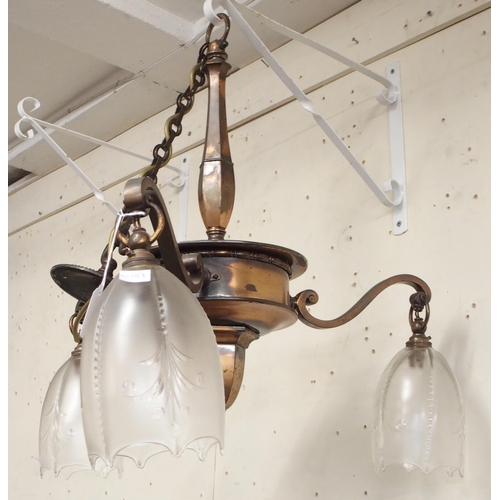 102 - A Victorian copper three branch chandelier with moulded glass shades