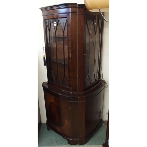 106 - A pair of 20th century mahogany glazed corner cabinets, 182cm high x 59cm wide (2)