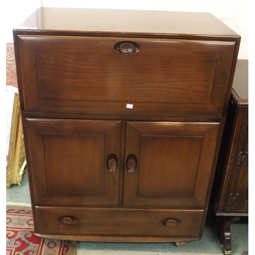 112 - A mid 20th elm and beech Ercol serving cabinet, 109cm high x 83cm wide x 46cm deep