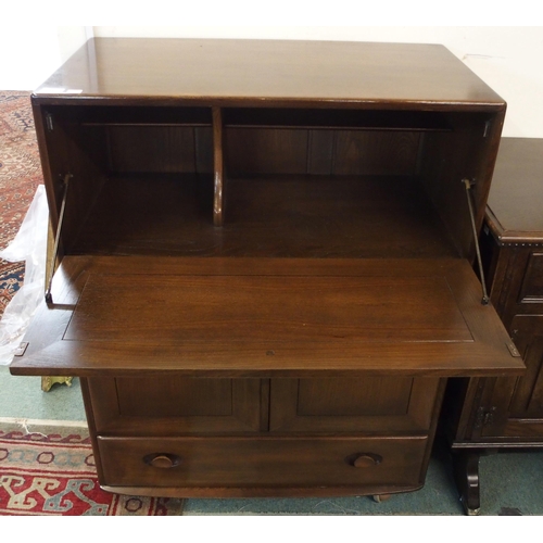 112 - A mid 20th elm and beech Ercol serving cabinet, 109cm high x 83cm wide x 46cm deep