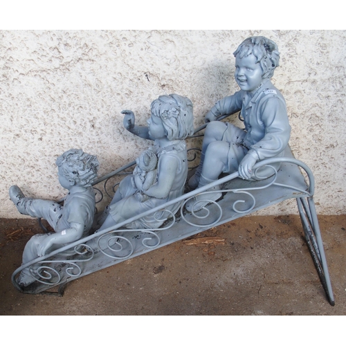 124 - A 20th century garden statue depicting children on slide