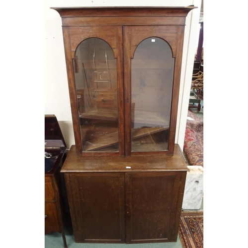 129 - A Victorian mahogany two door cabinet and a glazed two door bookcase (2)