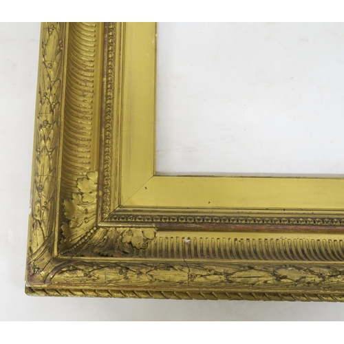 134 - A large 19th century giltwood and gesso picture frame, 98cm x 147cm