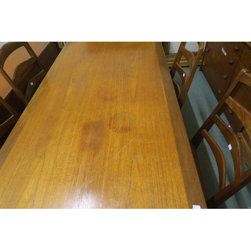 141 - A mid 20th century teak G Plan dining table and four G Plan ladderback dining chairs (5)