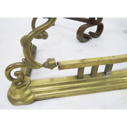 20 - A pair of 19th century wrought iron fire dogs and a brass fire fender (3)