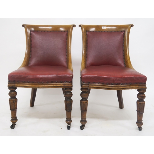 61 - A pair Victorian oak framed and rexine upholstered chairs (2)