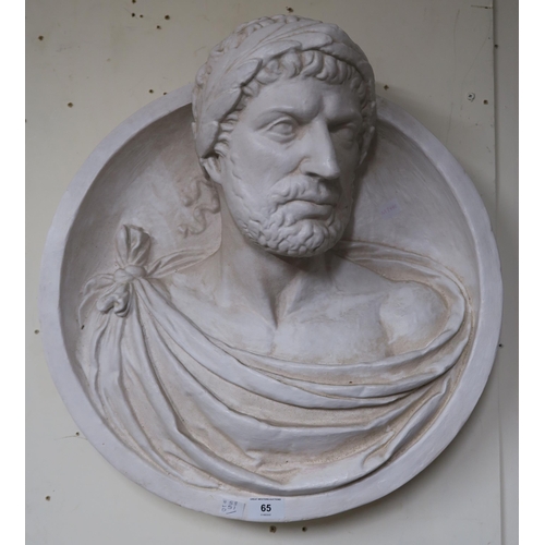 65 - A plaster cast wall plaque depicting a Roman Emperor, 53cm high x 51cm wide