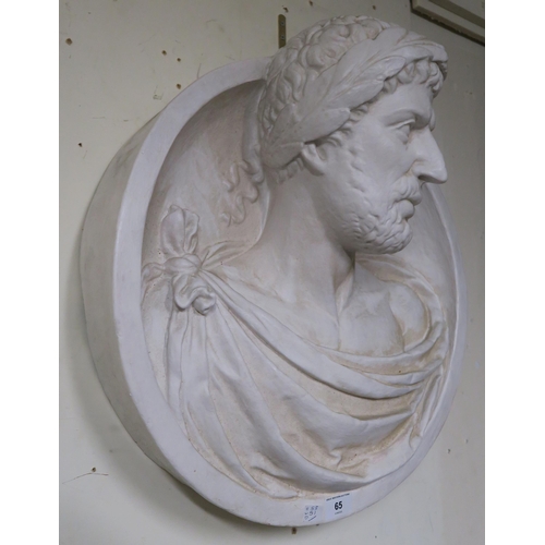 65 - A plaster cast wall plaque depicting a Roman Emperor, 53cm high x 51cm wide