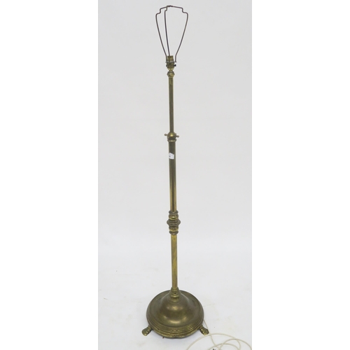 66 - A heavy brass adjustable standard lamp