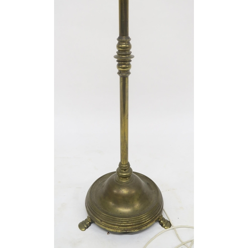 66 - A heavy brass adjustable standard lamp