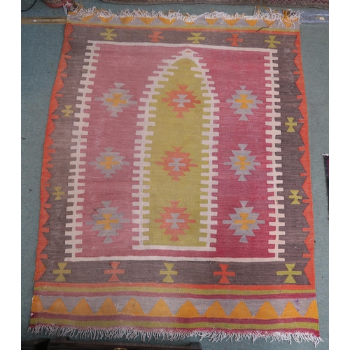 67 - A small pink ground kilim rug and another eastern rug (2)