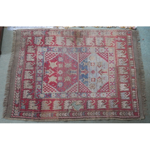 67 - A small pink ground kilim rug and another eastern rug (2)