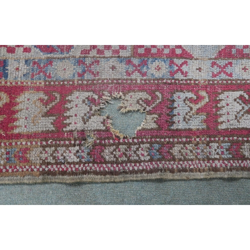 67 - A small pink ground kilim rug and another eastern rug (2)