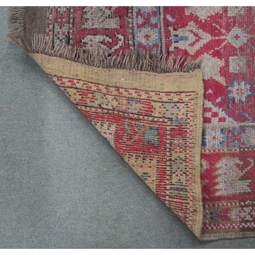 67 - A small pink ground kilim rug and another eastern rug (2)