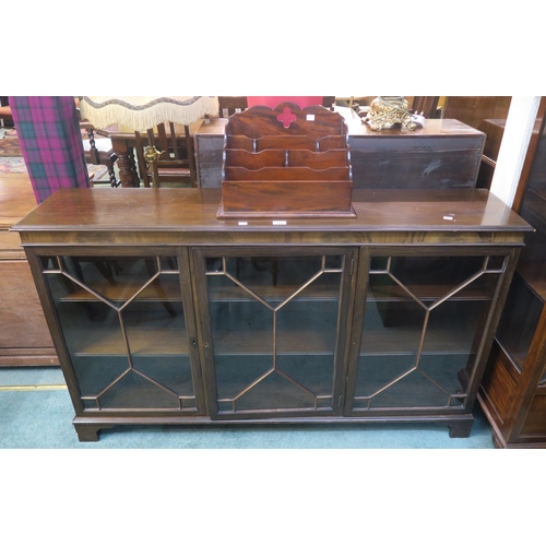 69 - A 20th century mahogany astragal glazed bookcase and a desk tidy (2)