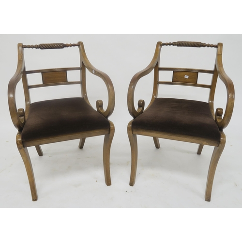 76 - A pair of mahogany and walnut sabre leg dining chairs with tapestry seats and another pair of sabre ... 