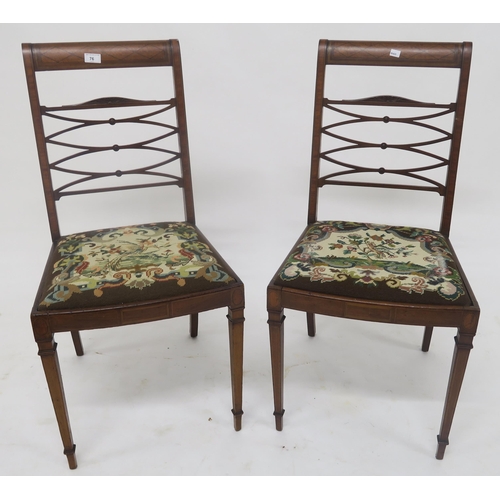 76 - A pair of mahogany and walnut sabre leg dining chairs with tapestry seats and another pair of sabre ... 